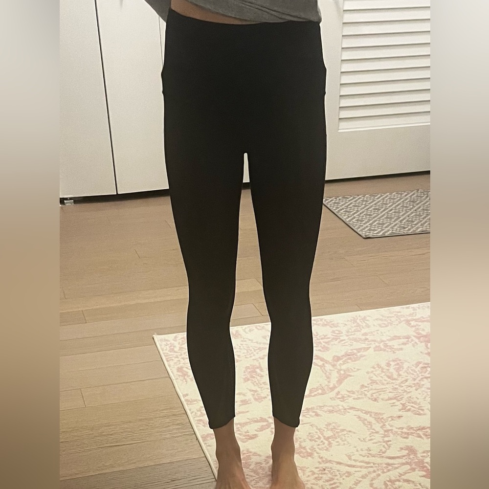 Lululemon black Leggings with mesh and see thru dots down side